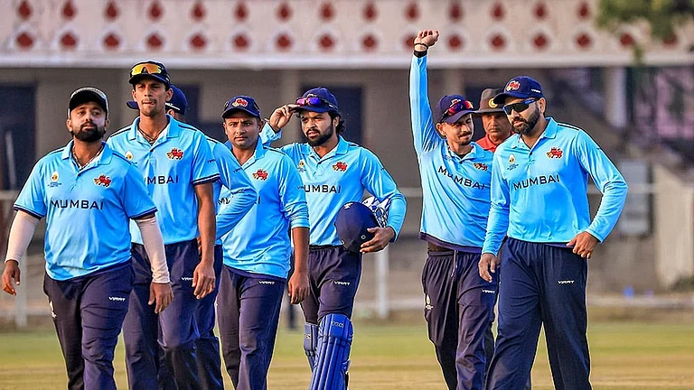 Mumbai’s Rohit Sharma, right, and others celebrate after winning a Vijay Hazare Trophy 2025-26 cricket match between Mumbai and Uttarakhand, at Sawai Mansingh Stadium, in Jaipur, Rajasthan. - | Photo: PTI