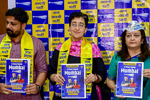 AAP leaders Atishi Marlena, centre, Preeti Sharma Menon and Ruben Mascarenhas unveil the party manifesto for the 2026 MCGM general elections at the Mumbai Press Club, in Mumbai.