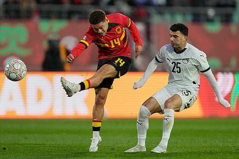 Angola's Manuel Benson kicks the ball during the Africa Cup of Nations group B soccer match between Angola and Egypt in Agadir, Morocco.