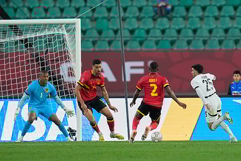 Angola's Nurio Fortuna and Egypt's Ahmed Zizo, right, compete for the ball during the Africa Cup of Nations group B soccer match between Angola and Egypt in Agadir, Morocco.
