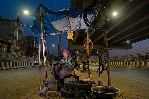 To support her family, Nirmala  took up the role of puncture repair mechanic and has been doing it from last 20 years at Shastri Park pusta number one in New Delhi, on February 24, 2025.