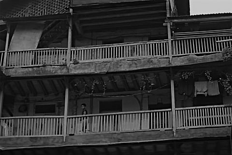 It was during a lazy summer afternoon when the front façade of the four storied building that was evacuated by the authorities only the day before that it collapsed in a blink with a loud yet muffled sound as the great clouds of concrete dust rose upwards to eventually settle down to a thin grey layer over the entire neighbourhood with the now extinguished evening sun to be replaced with the only streetlight in front to reveal the back wall of the now hollow building wall still standing tall with the parts of the broken floors jutting out precariously over the narrow street to reveal the insides of each home that was partially intact with some brass and stainless steel utensils neatly displayed in some colourfully tiled kitchens and clothes for varied age and gender hanging on the hooks on the walls and furniture new and old precariously placed silent as a backdrop to the stories of intertwined lives and the dramas that unfolded within these private spaces over seventy four years of the building soon to be entirely extinct
