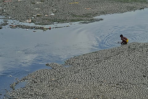 A deserted view of the Yamuna River, the dried Riverbed easily visible with only small streams flowing across the s ITO Barrage in New Delhi, March 27, 2025