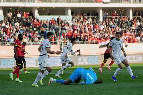 Angola goalkeeper Hugo Marques makes a save during the Africa Cup of Nations group B soccer match between Angola and Egypt in Agadir, Morocco.