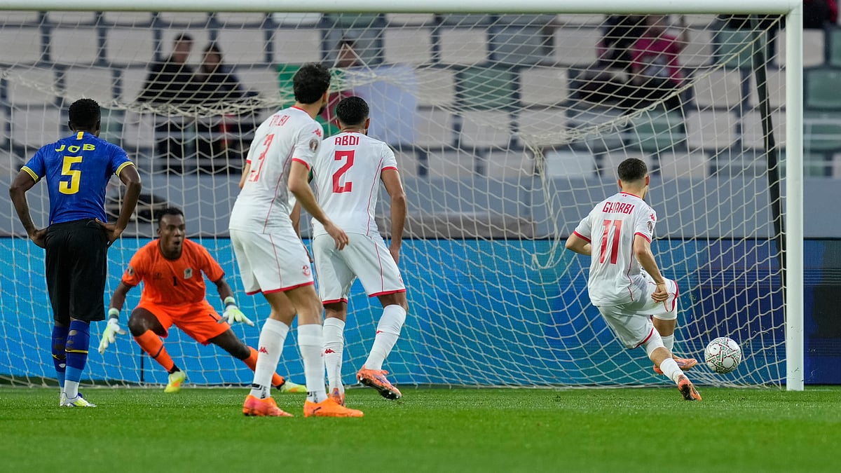 Tunisia's Ismael Gharbi, right, scores from a penalty kick during the Africa Cup of Nations group C soccer match between Tanzania and Tunisia in Rabat, Morocco, Tuesday, Dec. 30, 2025. - (AP Photo/Mosa'ab Elshamy)