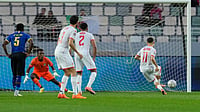 (AP Photo/Mosa'ab Elshamy) : Tunisia's Ismael Gharbi, right, scores from a penalty kick during the Africa Cup of Nations group C soccer match between Tanzania and Tunisia in Rabat, Morocco, Tuesday, Dec. 30, 2025.