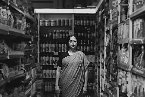 There is something eternal to her smile that beams  through a digital frame that in no way is a reminder of her unusually small body wrapped tight head to toe in white on the hard and cold enamelled white iron bed on her last day as the hospital staff looked for her slippers and the last cotton sari she wore while her son was settling the bill for her stay at the hospital for the last three months of her life which was somewhat an example of love restrained wordless and yet the one that revealed sparks of unfulfilled small desires which were more like habits that lasted even in her children beyond the day of her passing which was as mellow as the faded evening light through an unsuitably small window ajar above the head of her lifeless bundle
