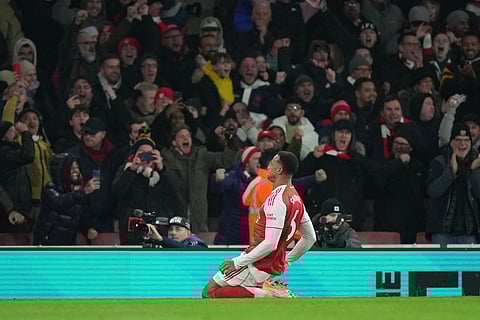 Arsenal's Gabriel celebrates after scoring his side's opening goal during the English Premier League soccer match between Arsenal and Aston Villa in London.
