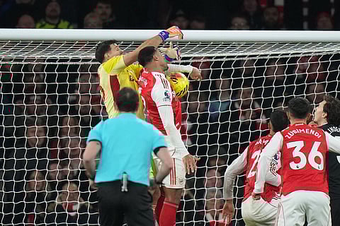 Arsenal's Gabriel, top right, scores his side's opening goal during the English Premier League soccer match between Arsenal and Aston Villa in London.