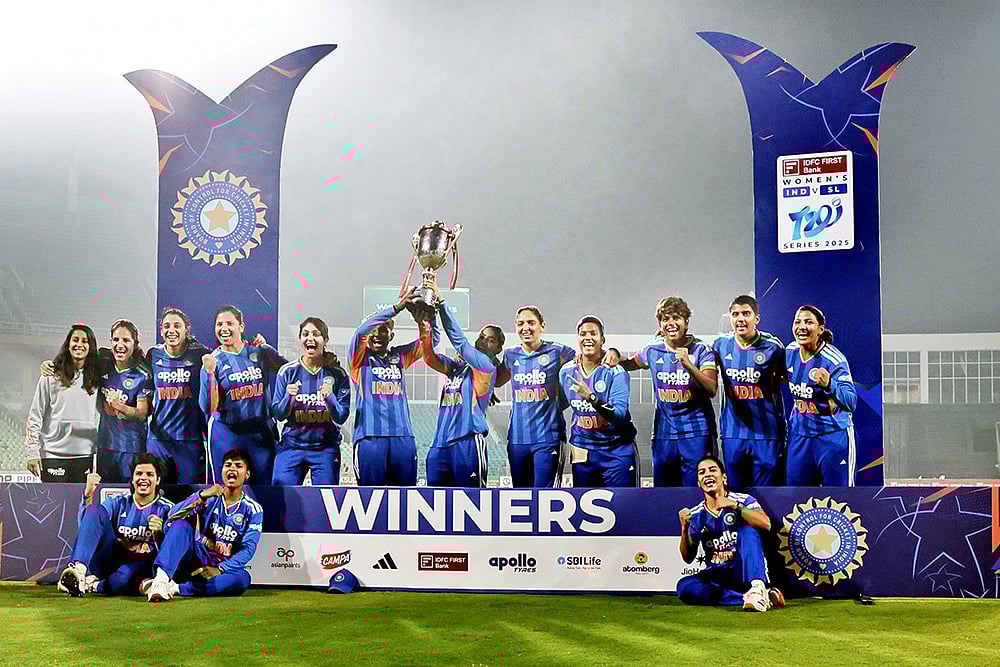 India's players celebrate with the trophy after winning the T20 International cricket match series against Sri Lanka at the Greenfield International Stadium in Thiruvananthapuram, Kerala. India Women won by 15 runs.  - | Photo: PTI