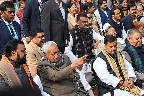 Bihar Chief Minister Nitish Kumar with state Deputy Chief Minister Samrat Choudhary and BJP National Working President Nitin Nabin during an event to pay tribute to party leader and Nitin's father Naveen Kishore Prasad Sinha on his death anniversary, in Patna.