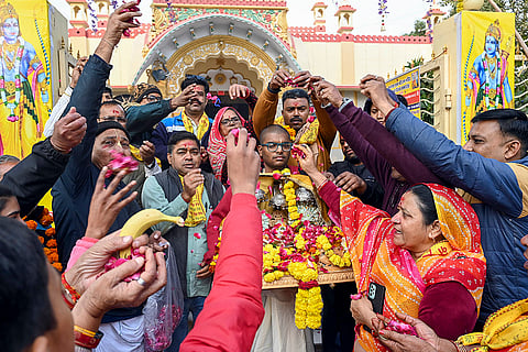People carry idols of Hindu deities during a religious procession marking the second consecration anniversary of Ayodhya's 'Ram Mandir', in Bikaner.