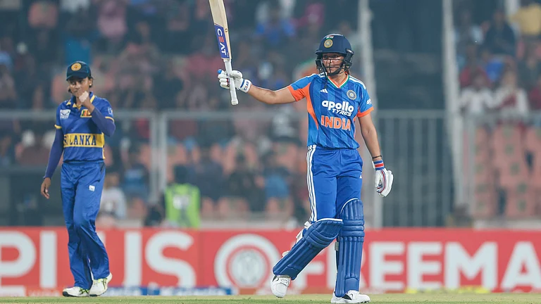 India's Harmanpreet Kaur celebrates her half-centry during the fifth women's T20I against Sri Lanka on December 30, 2025. - | Photo: X/BCCIWomen