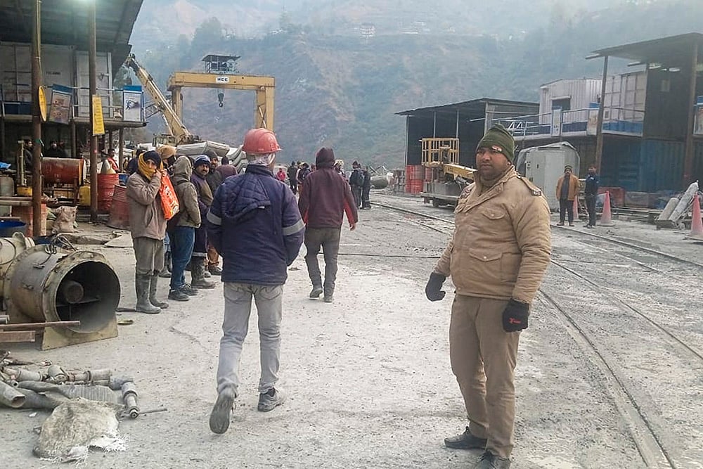 Security personnel at the site after a loco train collided with a goods train on Tuesday night inside Pipalkoti tunnel of the Vishnugad-Pipalkoti Hydro Electric Project tunnel in Gopeshwar area, Chamoli district. Atleast 60 people were injured in the incident.  - | Photo: PTI