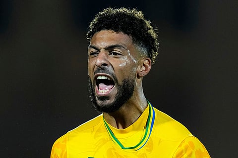 Gabon's Denis Bouanga celebrates after scoring during the Africa Cup of Nations group F soccer match between Gabon and Ivory Coast, in Marrakech, Morocco.