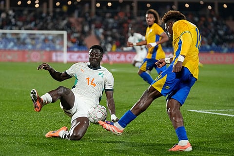 Gabon's Mario Lemina is challenged by Ivory Coast's Oumar Diakité during the Africa Cup of Nations group F soccer match between Gabon and Ivory Coast, in Marrakech, Morocco.