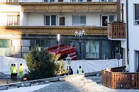 Police officers inspect the area where a fire broke out at the Le Constellation bar and lounge leaving people dead and injured, during New Year’s celebration, in Crans-Montana, Swiss Alps, Switzerland.
