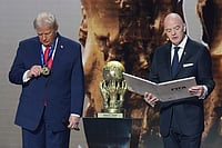 Evan Vucci : President Donald Trump is presented with the inaugural FIFA Peace Prize by FIFA President Gianni Infantino during the 2026 FIFA World Cup draw at the Kennedy Center, Friday, Dec. 5, 2025, in Washington. 