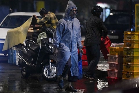 A man walks on a road amid rainfall, in Mumbai. The New Year 2026 began on a rainy note for Mumbaikars as several parts of the country’s financial capital witnessed heavy showers.