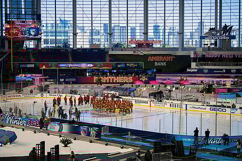 The Florida Panthers team pose for a picture during practice for the NHL Winter Classic outdoor hockey game at loanDepot Park in Miami.