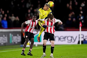 | Photo: John Walton/PA via AP : Tottenham Hotspur's Richarlison and Brentford's Keane Lewis-Potter, right, in action during the English Premier League soccer match between Brentford and Tottenham Hotspur in London.