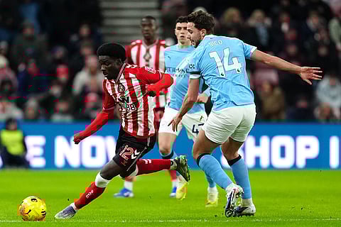Sunderland's Eliezer Mayenda, left, and Manchester City's Nico Gonzalez in action during the English Premier League soccer match between Sunderland and Manchester City in Sunderland, England. 