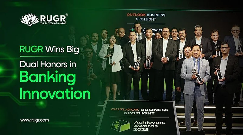 Group of professionals holding awards at Outlook Business Spotlight Achievers Awards 2025