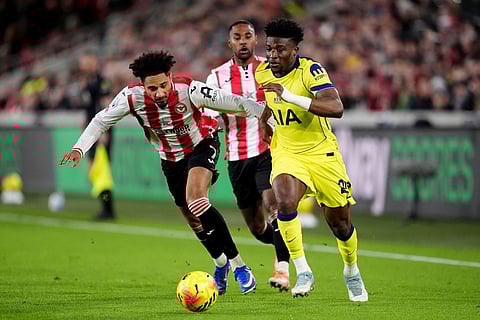 Brentford's Kevin Schade, left, and Tottenham Hotspur's Mohammed Kudus in action during the English Premier League soccer match between Brentford and Tottenham Hotspur in London.