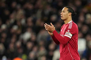 | Photo: AP/Jon Super : Liverpool's Virgil van Dijk applauds to supporters at the end of the English Premier League soccer match between Liverpool and Leeds United in Liverpool, England