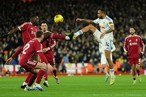 Leeds' Lukas Nmecha, front right, and Liverpool's Ibrahima Konate challenge for the ball during the English Premier League soccer match between Liverpool and Leeds United in Liverpool, England.