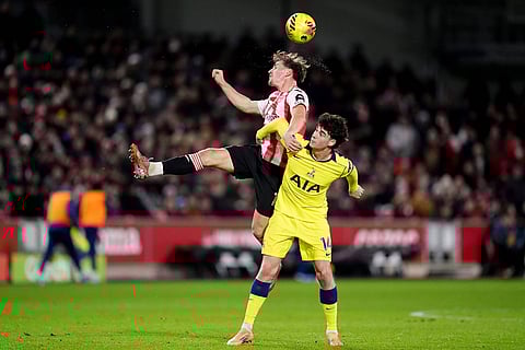Brentford's Yehor Yarmolyuk (left) and Tottenham Hotspur's Archie Gray in action during the English Premier League soccer match between Brentford and Tottenham Hotspur in London.