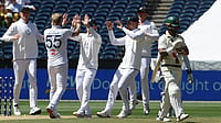 | Photo: AP/Hamish Blair : England's Ben Stokes, second left, is congratulated by teammates after taking the wicket of Australia's Jake Weatherald, right, on Day 2 of their Ashes cricket test match in Melbourne.
