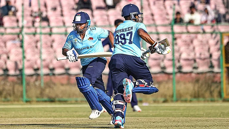 Mumbai's Sarfaraz Khan and Musheer Khan run between the wickets during the Vijay Hazare Trophy 2025-26 cricket match between Mumbai and Uttarakhand, at Sawai Mansingh Stadium, in Jaipur. - | Photo: PTI