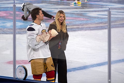 Florida Panthers Carter Verhaeghe skates with his family during practice for the NHL Winter Classic outdoor hockey game at loanDepot Park in Miami. 