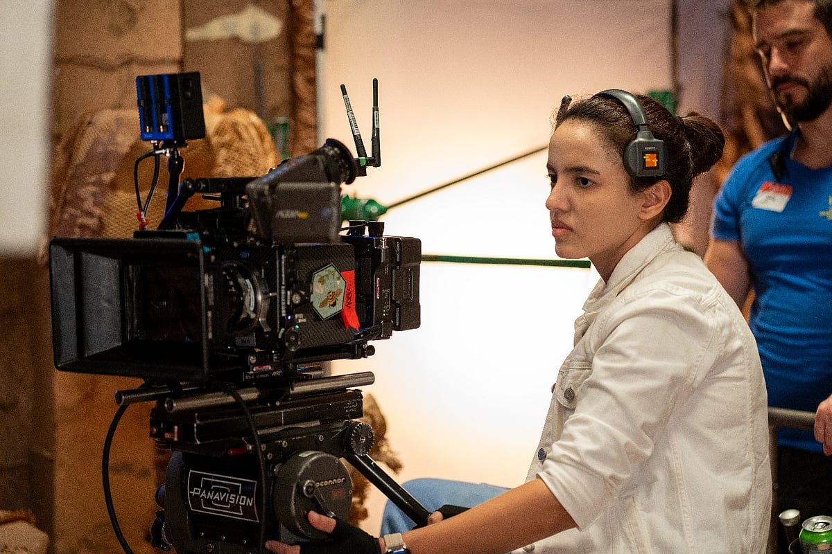 Simran Sawhney using a Panavision camera on set