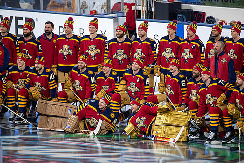 Florida Panthers players pose for a group photo during practice for the NHL Winter Classic outdoor hockey game at loanDepot Park, in Miami. 