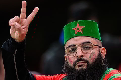 A Moroccan fan waits for the start of the Africa Cup of Nations group A soccer match between Zambia and Morocco in Rabat, Morocco, Monday, Dec. 29, 2025. 