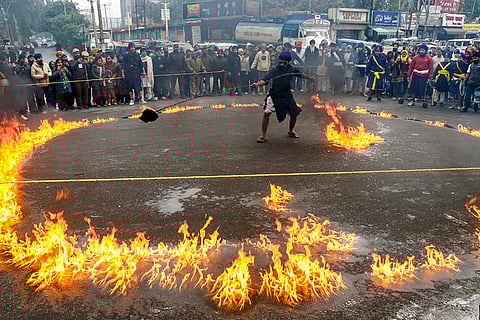 A member of the ‘Sikh’ community performs ‘Gatka’, the community’s traditional martial arts, during a religious procession celebrating the birth anniversary of tenth Sikh Guru, Guru Gobind Singh, in Jammu.