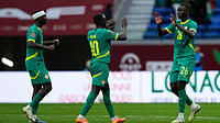 Photo: AP : Senegal's Pape Gueye, right, celebrates with teammates after scoring against Sudan during their Africa Cup of Nations round of 16 match in Tangier, Morocco.