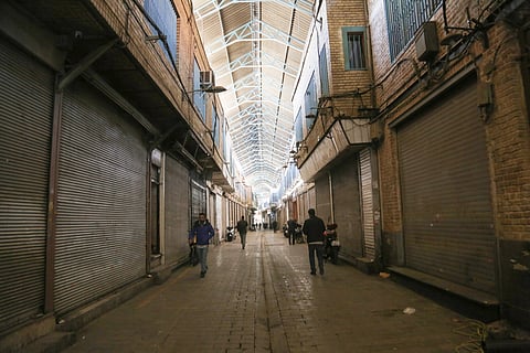 TEHRAN, IRAN - DECEMBER 31: Shopkeepers close their businesses during a protest against rising prices and market instability driven by a rapid increase in foreign exchange rates.