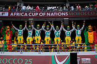 | Photo: AP/Themba Hadebe : Senegal fans support their national team during the Africa Cup of Nations group D soccer match between Senegal and DR Congo in Tangier, Morocco, Saturday, Dec. 27, 2025. 