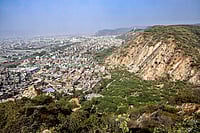 | Photo: PTI : The Aravalli Hills, as seen from the Sun temple at Galta ji, in Jaipur, Saturday, Jan. 3, 2026. The Supreme Court on Monday kept in abeyance its Nov. 20 directions that accepted a uniform definition of the Aravalli hills and ranges. It also directed that until further orders, no permission shall be granted for mining in the 'Aravalli Hills and Ranges', as defined in the Aug. 25, 2010, FSI report, without its prior permission. 