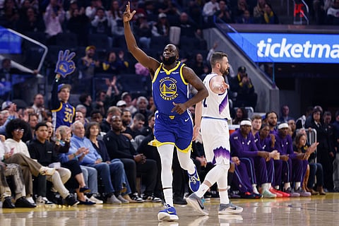Golden State Warriors forward Draymond Green (23) scores a 3-pointer against the Utah Jazz in the first quarter during an NBA basketball game in San Francisco.