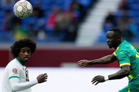 Sudan's Sheddy Ezeldin and Senegal's Sadio Mane compete for a header during the Africa Cup of Nations best of 16 soccer match between Senegal and Sudan in Tangier, Morocco.