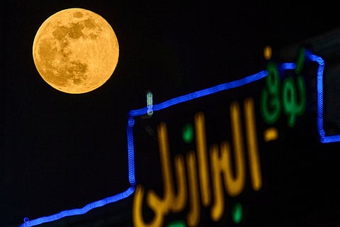 The full moon, known as the Wolf Supermoon, rises above Baghdad, Iraq.