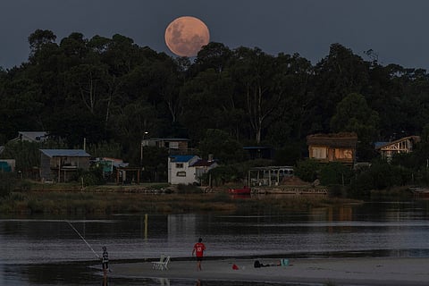 A super wolf moon rises over Pando stream in El Pinar, the Canelones Department of Uruguay.