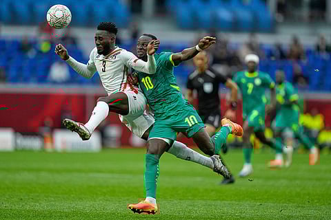 Sudan's Mohamedahmed Saeed Ahmed, left, and Senegal's Sadio Mane fight for the ball during the Africa Cup of Nations best of 16 soccer match between Senegal and Sudan in Tangier, Morocco.