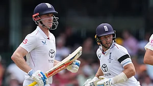 (AP Photo/Mark Baker) : England's Joe Root runs between the wickets with teammate Harry Brook, left, during play on day one of the fifth and final Ashes cricket test between England and Australia in Sydney, Sunday, Jan. 4, 2026.