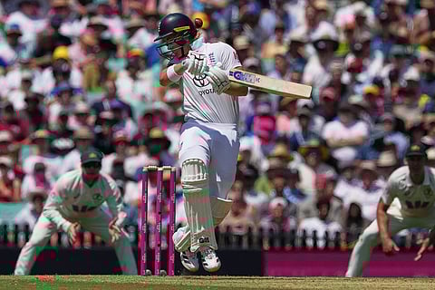 England's Jacob Bethell reacts while batting during play on day one of the fifth and final Ashes cricket test between England and Australia in Sydney.
