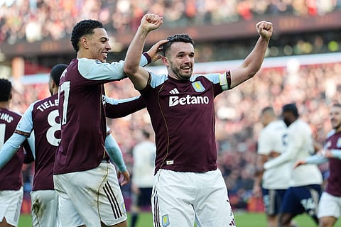 Aston Villa's John McGinn celebrates scoring their side's second goal during their English Premier League soccer match against Nottingham Forest in Birmingham, England.